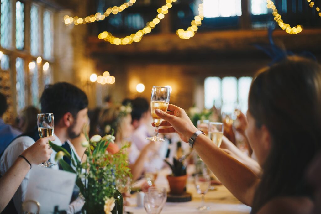 a group of people raising their glasses for a toast