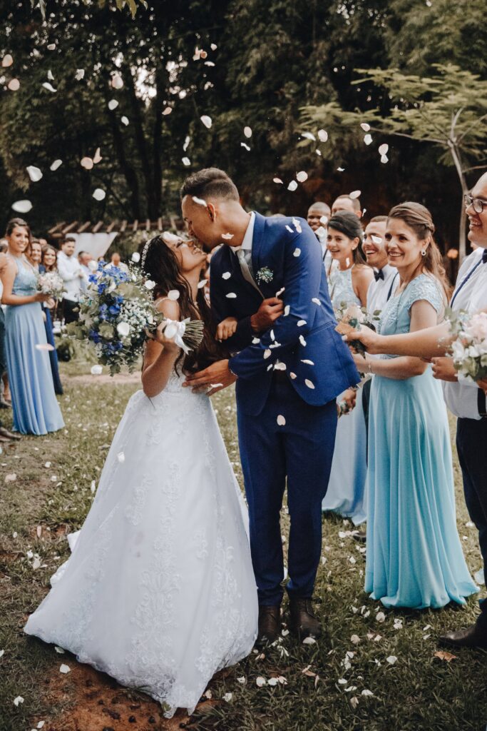 A bride and groom kissing after recently being married