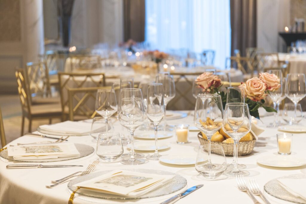 a fine-dining table setting with white and gold colors