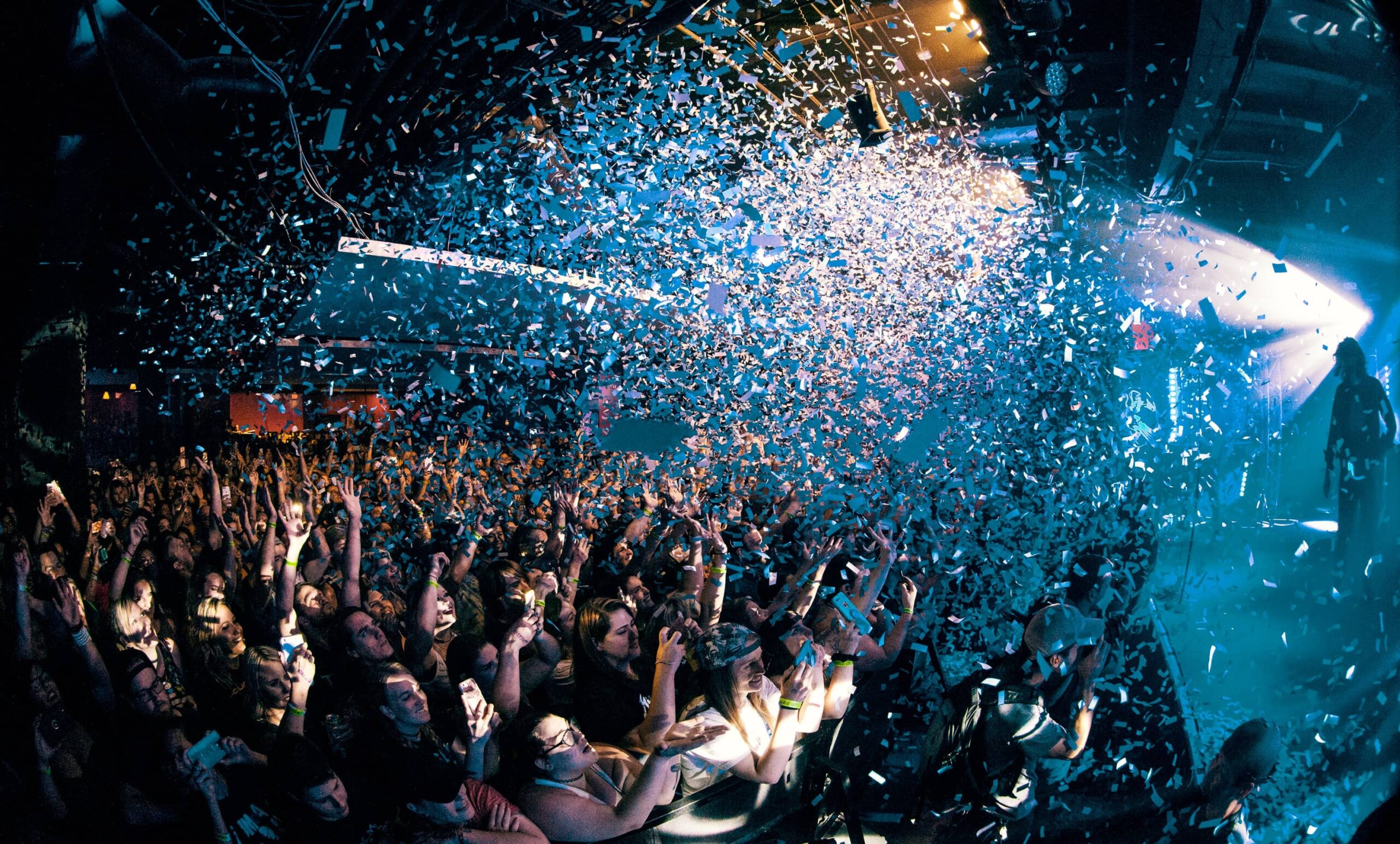 Confetti dropping over a concert crowd