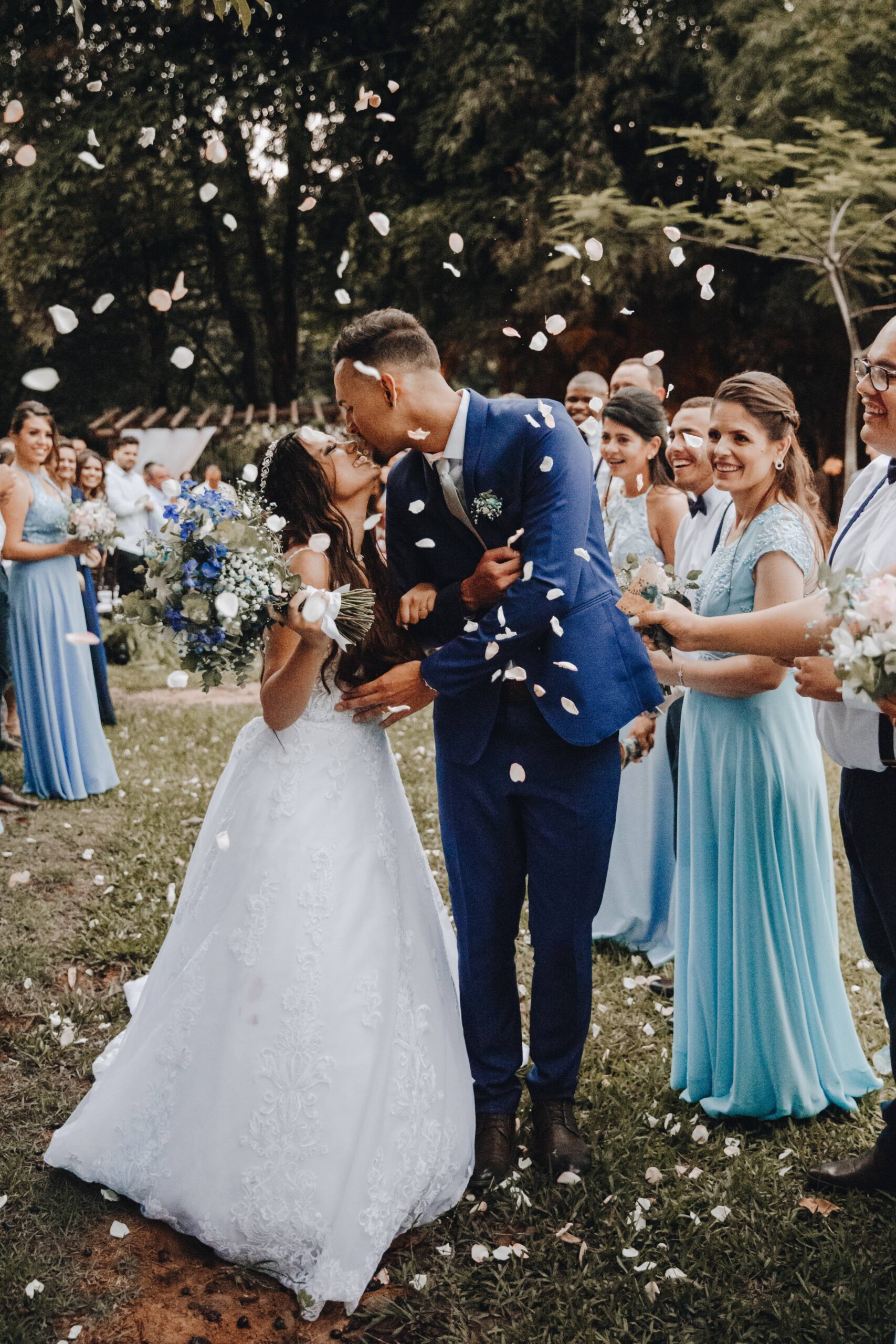 A bride and groom kissing after recently being married