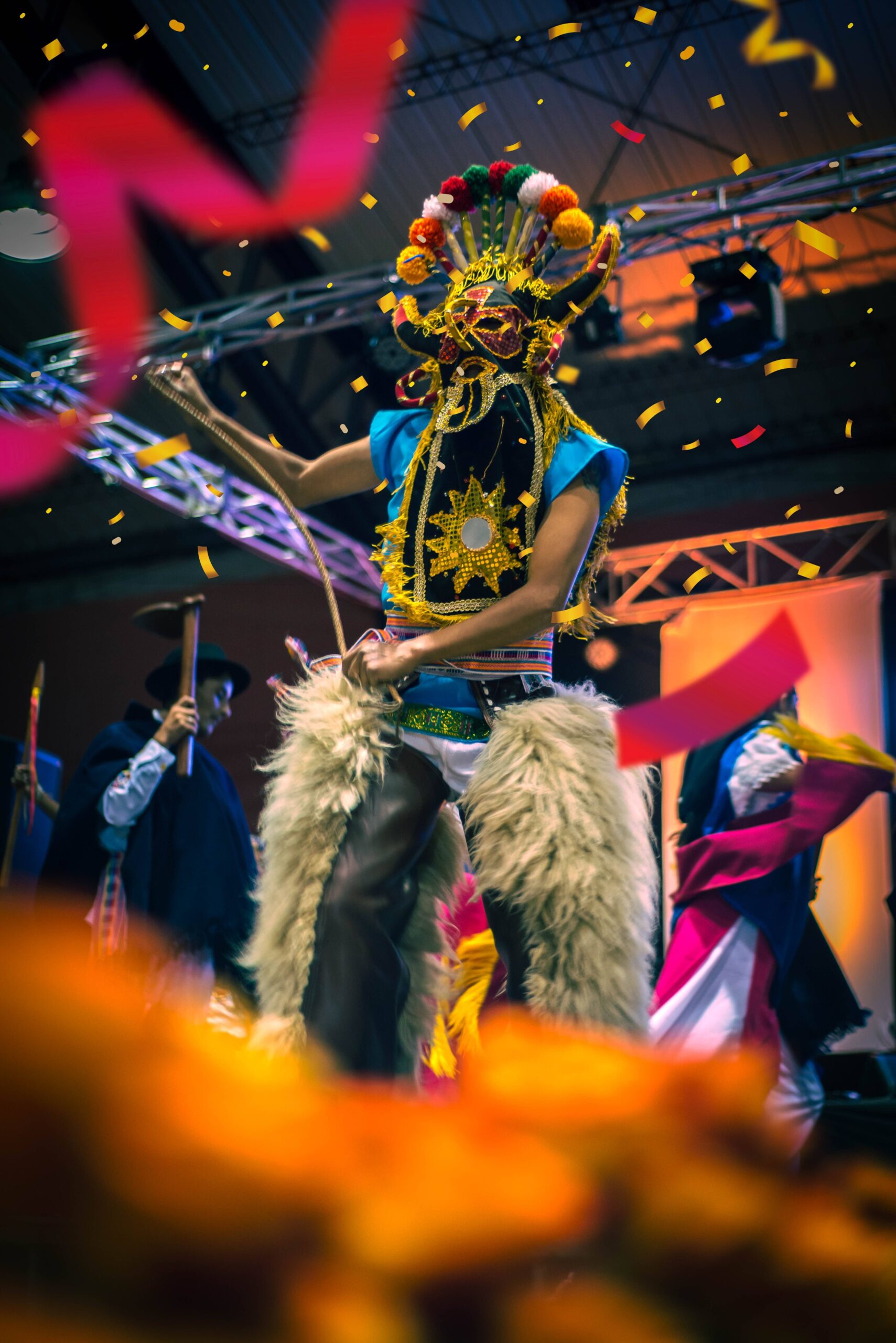 a man wearing a mask at a festival